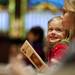 Alanna Deitz, three, smiles with her sister, Ava, at the Sing Along With Santa event on Saturday. Daniel Brenner I AnnArbor.com